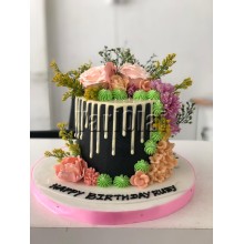 White Drip Cake With Flowers